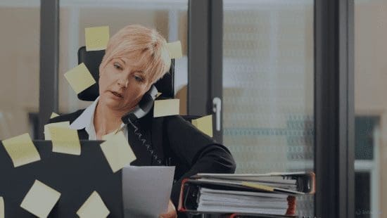A Customer Success Manager stuck between calls notes and multitasking
